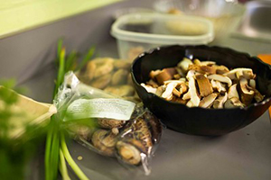 Mushrooms in a wooden bowl on a kitch counter