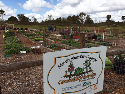 a view of the North Sumter County Community Garden including a sign