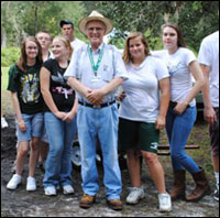 Master Gardener Chuck Smarr with young volunteers