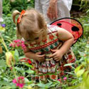 Little girl in butterfly garden