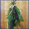 Decorative swag on door with greenery and purple beautyberry