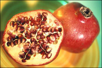 A pomegranate opened to reveal seeds