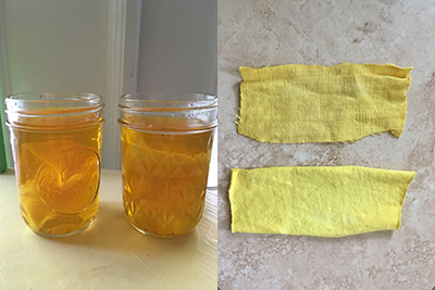 two glass jars with strips of fabric inside soaking in deep yellow liquid and two strips of fabric dyed yellow and sitting on a counter 