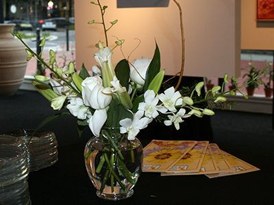 An arrangement of various flowers that are all white