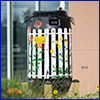 A brightly painted rain barrel