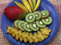 Plate of sliced tropical fruit