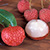 Red bumpy round lychee fruits
