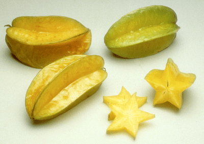 three whole carambola fruit and three slices showing the star shape, photo by Florida Department of Agriculture and Consumer Services