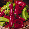 Red and green cubanelle peppers in a basket