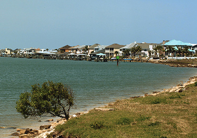 Grassy area near a coastal inlet.