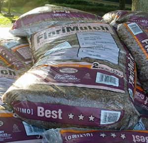 Bags of mulch, made from the invasive tree melaleuca.